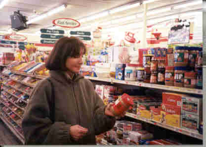 picture of woman reading a food label