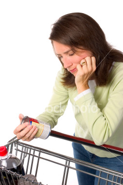 Picture of a woman reading a food label
