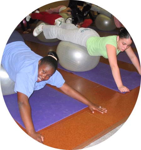 thumbnail Teen Esteem students work out on yoga physio ball under the direction of a certified personal trainer and 
their teacher, who is also certified as a personal trainer